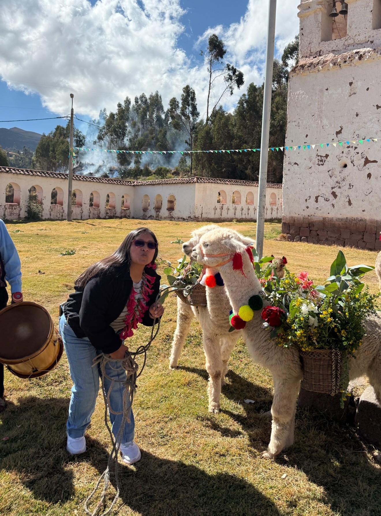 Amandina Hjancco with a decorated llama in Cusco, Peru