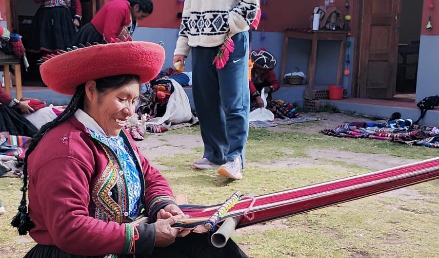 Andean weaver working a traditional backstrap loom in Cusco, Peru